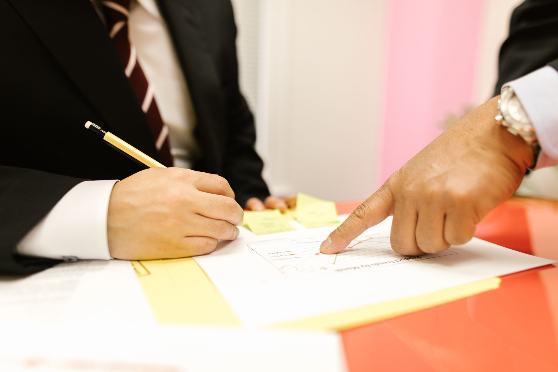 Colleagues reviewing a document together